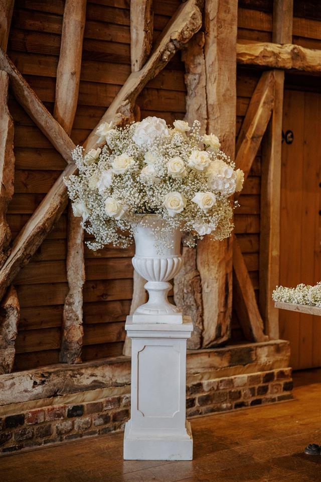 White gyp flower urns for The Barn at Redcoats wedding ceremony